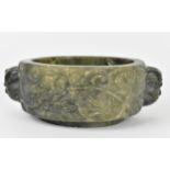 A Chinese soapstone censer, late 19th/20th century, of circular form with mythical beast handles