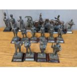 Fifteen pewter model soldiers through the years and two silver plated military figures on horseback,