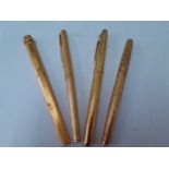 Four gold plated pens comprising Cartier with brushed decoration, 2 Parker pens and another