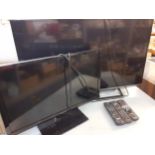 A Panasonic 40" flatscreen television together with a smaller 23" one and three Panasonic remotes