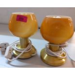 A pair of retro bedside lights having amber glass shades Location: