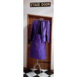 Valentino Boutique- A purple silk 2 piece skirt suit having a vertical black ruffled trim to