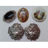 A silver plated belt buckle with the image of a young lady, together with a bone china plaque