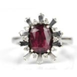 An Art Deco style white metal, diamond and pink tourmaline dress ring, the cushion cut tourmaline in