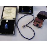A group of lapis lazuli and gold jewellery to include a lozenge beaded necklace with 9ct gold