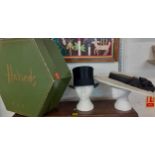 A vintage Bates Hatters black brushed silk felt top hat with black fabric band together with a