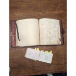 A late 19th/early 20th century black leather Toy Company manufacturing costings book and an