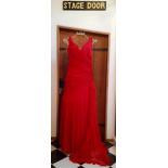 A Bellville Sassoon Lorcan Mullany, red evening gown having a criss-cross ribbon design to the