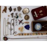 A small quantity of costume jewellery to include a 1953 Coronation brooch with a picture of Queen