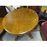 A 19th century Regency style walnut table, oval top quarter cut walnut veneer, supported on a