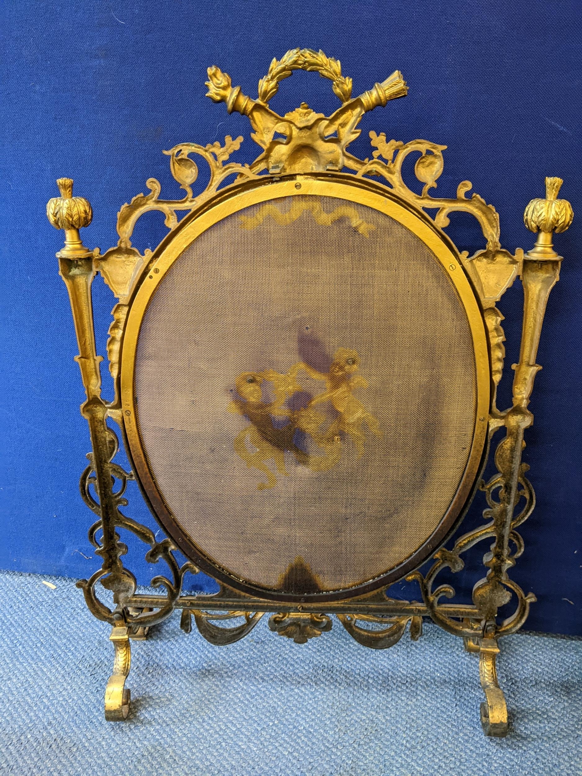 A late 19th Century French brass firescreen in the Rococo style with winged cherubs centred on a - Image 2 of 2