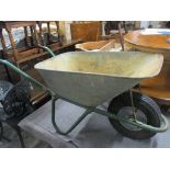 A vintage metal wheelbarrow Location: