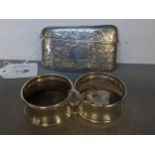 An Edwardian silver card case and a pair of silver napkin rings Location: