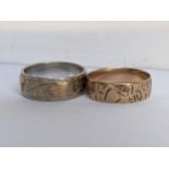 Two 9ct gold bands, both engraved with a floral design, 7.7g Location: