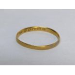 A 22ct gold wedding band, 0.9g Location: