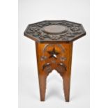 A late 19th century Anglo Indian Moorish octagonal and carved table, the to deeply carved with