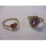 Two 9ct gold rings, one set with coral the other clear and purple stones, 3.2g Location: