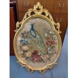 A Victorian wall hanging tapestry of a peacock in a gilt frame with floral motifs, 86cm H x 59cm W