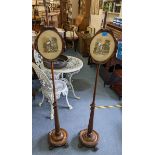 A pair of William IV rosewood poles screens having flower brass finials, turned columns and raised