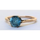 A yellow metal blue topaz ring, 2.2g Location: