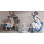 Two Nao figures of seated young girls A/F and a Chinese ceramic model of a goose with her goslings