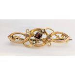 A 9ct gold brooch having a Princess cut garnet and two seed pearls, 2.4g Location: