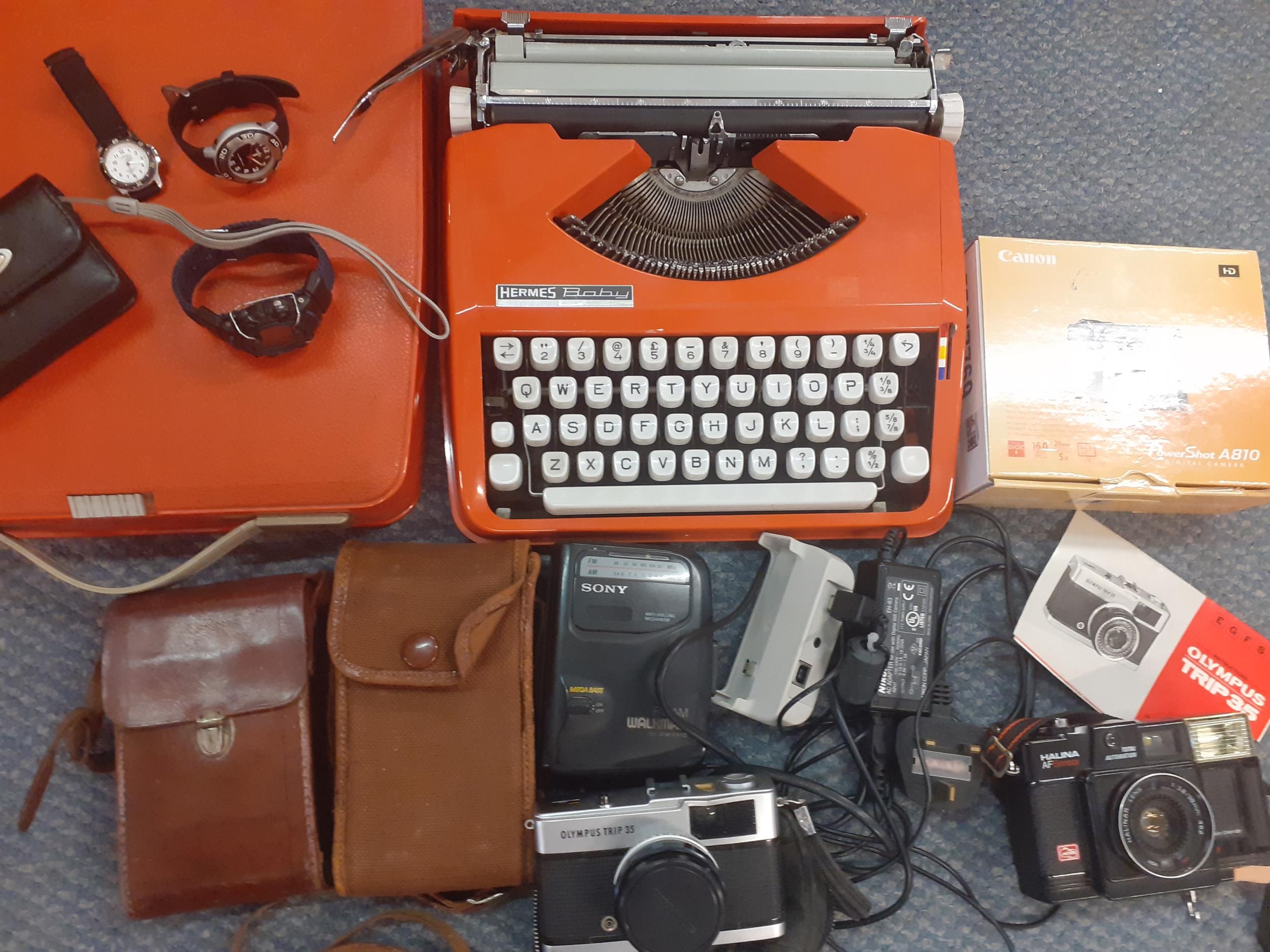 Mixed cameras and typewriter, G Shrek and other watches Location: