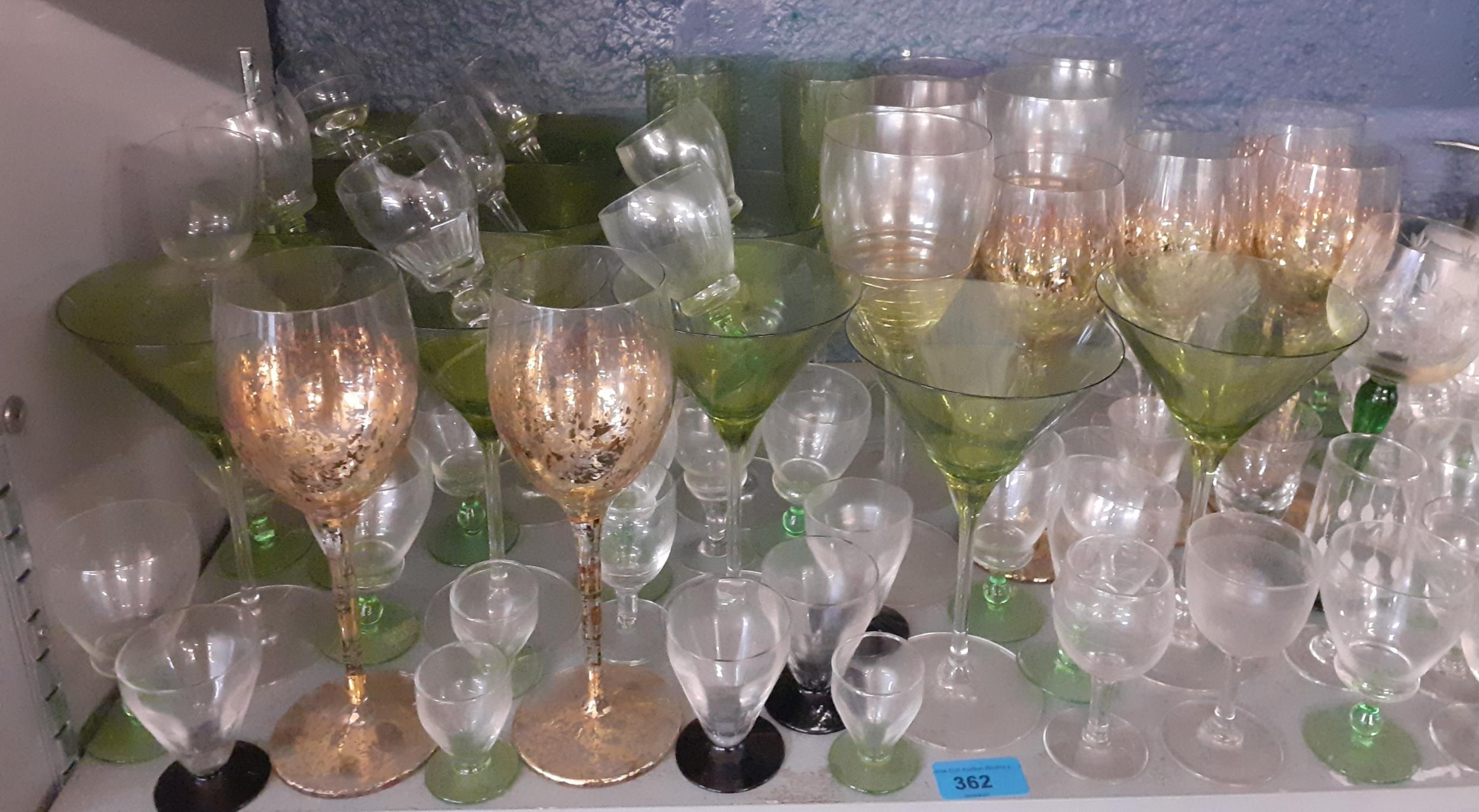 A set of John Lewis green cocktail glasses, and other pedestal domestic glassware. Location:3:1