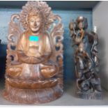A carved treen buddha, 48cm h and a carved tribal statue Location:
