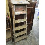 An old wooden folding step ladder Location: