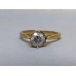 An 18ct gold ring inset with a moissanite, 3.8g Location: