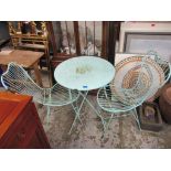 A green painted metal folding garden table and two matching chairs Location: