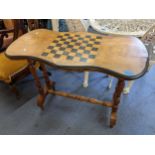 A Victorian walnut games table, 69cmH x 89cm W