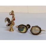 A pair of gold earrings stamped 10k together with a yellow metal charm of a chicken, 5.6g Location: