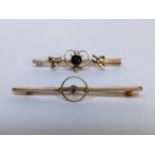 Two 9ct gold brooches, both inset with amethysts and seed pearls, 3.6g Location: