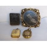 A silver vesta case together with a gold plated brooch and two pendants Location: