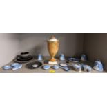 A collection of Wedgwood Jasperware and basalt items to include miniatures, bells, and cup and
