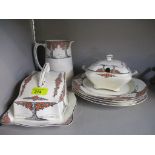 A Crown Ducal Art Deco Orange Tree sauce tureen, cheese dish and stand, jug and four dinner plates