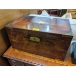 A 19th century rosewood campaign writing slope with brass plaque to the lid and twin carrying