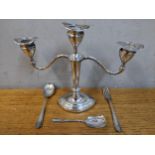 A silver three branch candelabrum together with a silver fork and two silver spoons Location: