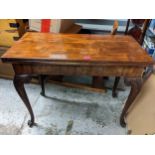 A 19th century mahogany card table with concertina action cabriole legs, with carved knees, 73cm h x