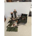 A vintage Action Man together with accessories to include uniform, rifles, mission pad and a large