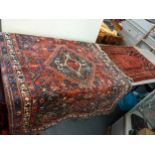 A Middle Eastern red ground rug, together with a prayer mat Location: