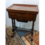 A 19th century French mahogany work/sewing table having a hinged top opening to reveal a fitted