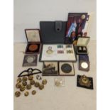 A mixed lot of commemorative coins and others to include a Lusitania medal, Queen Victorian 1897