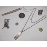 A mixed lot of silver items to include two silver ingot necklaces, a silver necklace having a