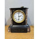 A black slate and marble cased mantel clock with an enamelled dial on a French movement Location: