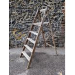 A vintage beech folding step ladder with reeded treads, 130cm h Location: LAB