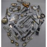 A mixed quantity of flatware to include Portuguese white metal spoon, mixed silver plated examples