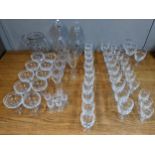 A part suite of glasses to include ten Champagne saucers, white wine, red wine, sherry, and others